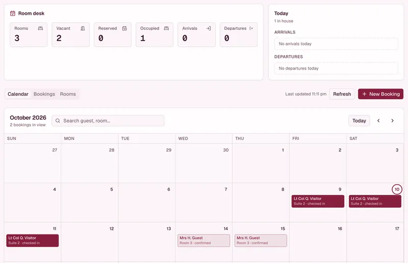 Demo unit room desk: three rooms, one occupied, and an October calendar with a checked-in guest in Suite 2 and a confirmed booking.